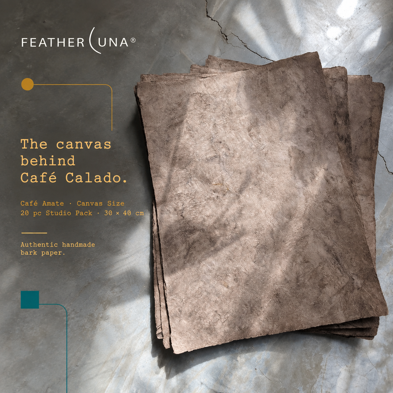 A stack of canvas-size Café amate bark paper sheets in sunlight on grey stone