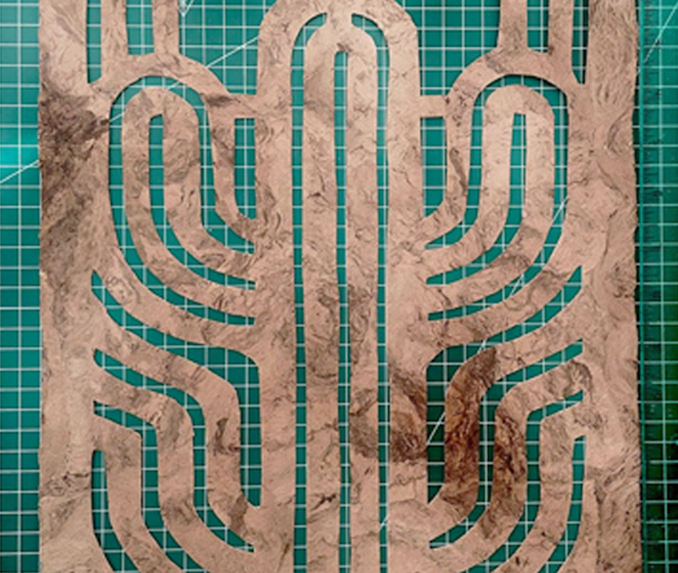 El Cactus cut from Café amate, lying on a green cutting mat