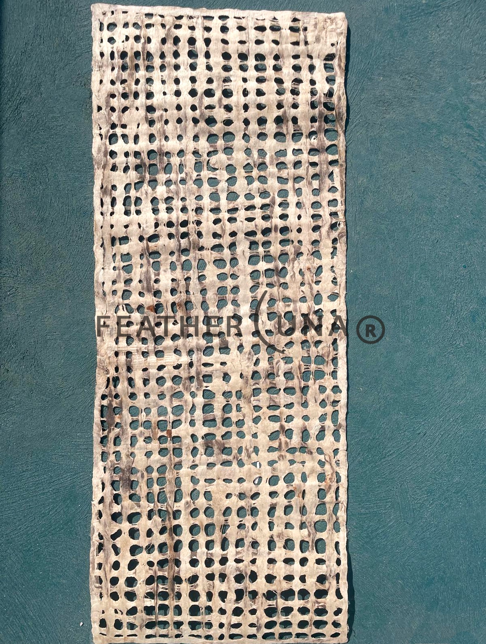 Café con Leche amate paper sheet, full length, on a green floor