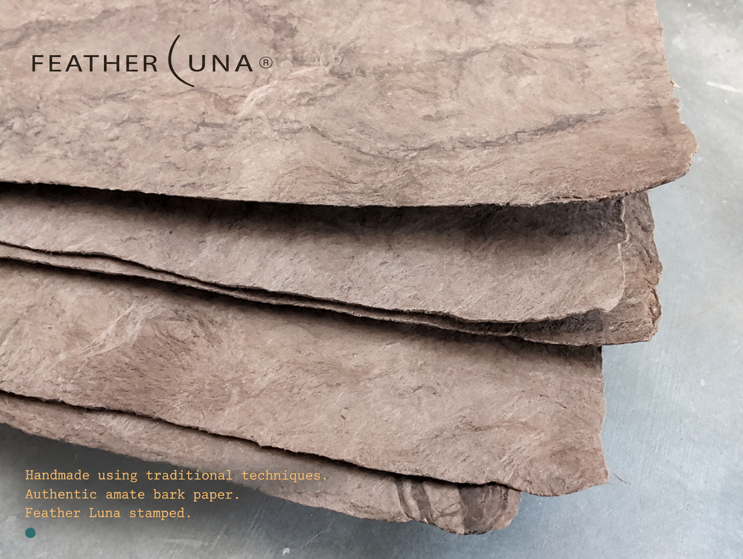 Close-up of the deckled edges of stacked Café amate bark paper sheets