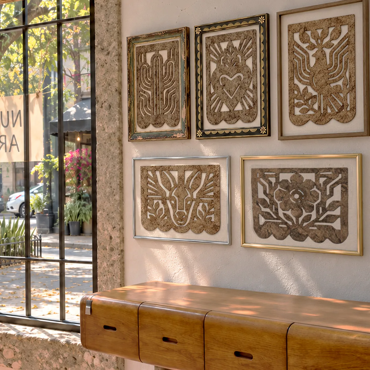 All five Café Calado pieces framed on a gallery wall above a wooden console